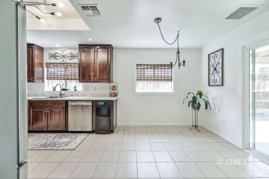 1233 Mayo Street Ridgecrest, CA 93555 - Photo 14 of 32 a bathroom with a sink a vanity and a mirror