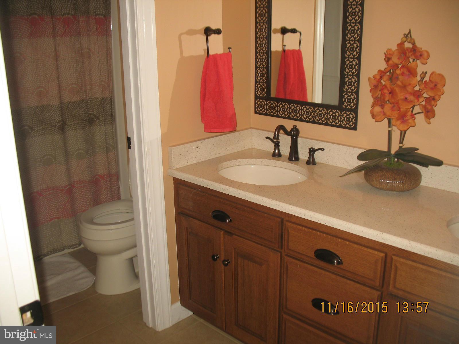 13908 Barnhart Road Clear Spring, MD 21722 - Photo 14 of 16 a bathroom with a toilet sink and mirror