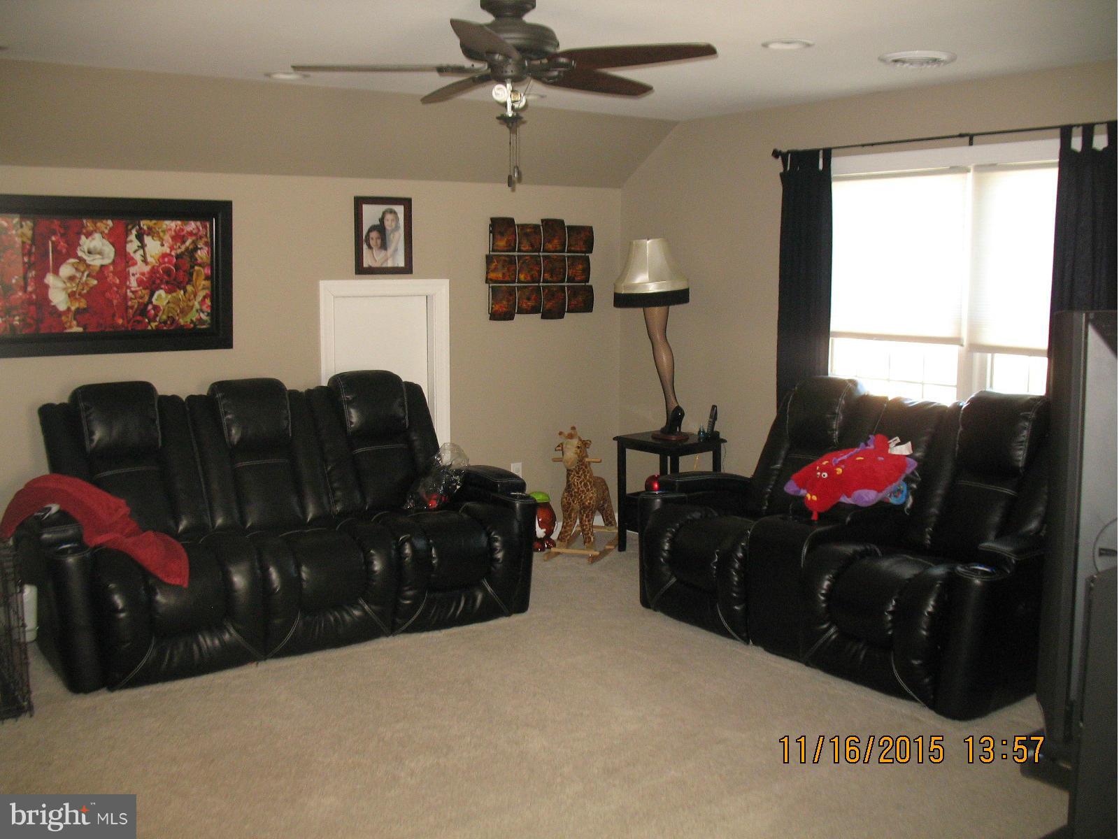13908 Barnhart Road Clear Spring, MD 21722 - Photo 15 of 16 a living room with furniture and a flat screen tv