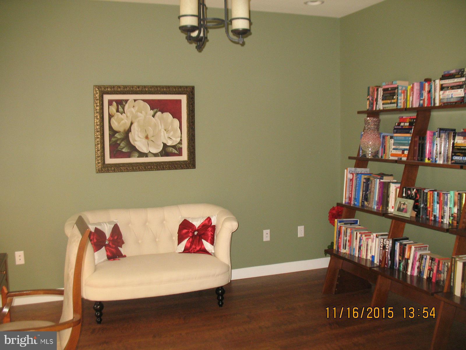 13908 Barnhart Road Clear Spring, MD 21722 - Photo 8 of 16 a living room with furniture and a book shelf