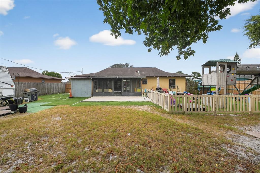 1644 Ruth Street Cocoa, FL 32926 - Photo 26 of 38 a front view of a house with a garden and yard