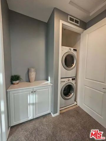 a view of a storage & utility room with washer and dryer