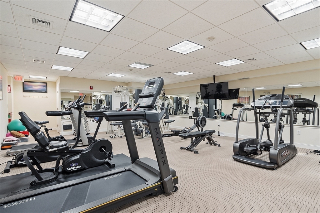 4 Sterling Hill Lane, Unit 424 Exeter, NH 03833 - Photo 20 of 24 a view of a room with gym equipment