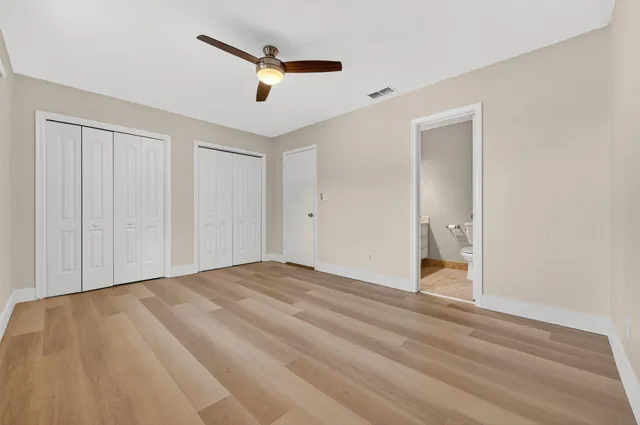 a white toilet sitting next to a bath tub
