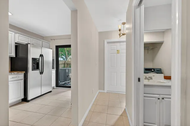 a kitchen with a sink stainless steel appliances and cabinets