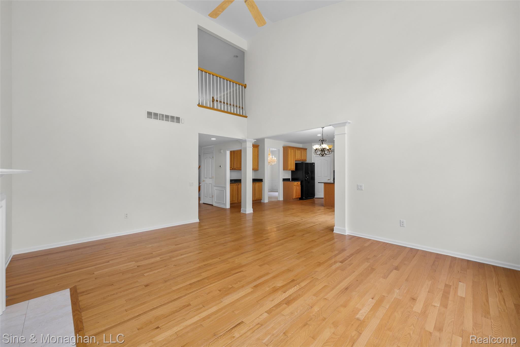 48322 Antique Road Canton, MI 48187 - Photo 14 of 45 Two-story living area with wood-finish flooring