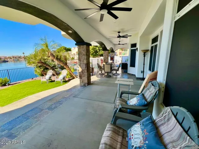 a view of a chairs and table in patio