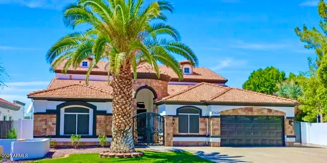 a view of a house with swimming pool and porch