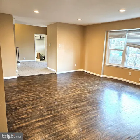 a view of a livingroom with wooden floor