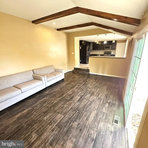 a view of a living room with a large window