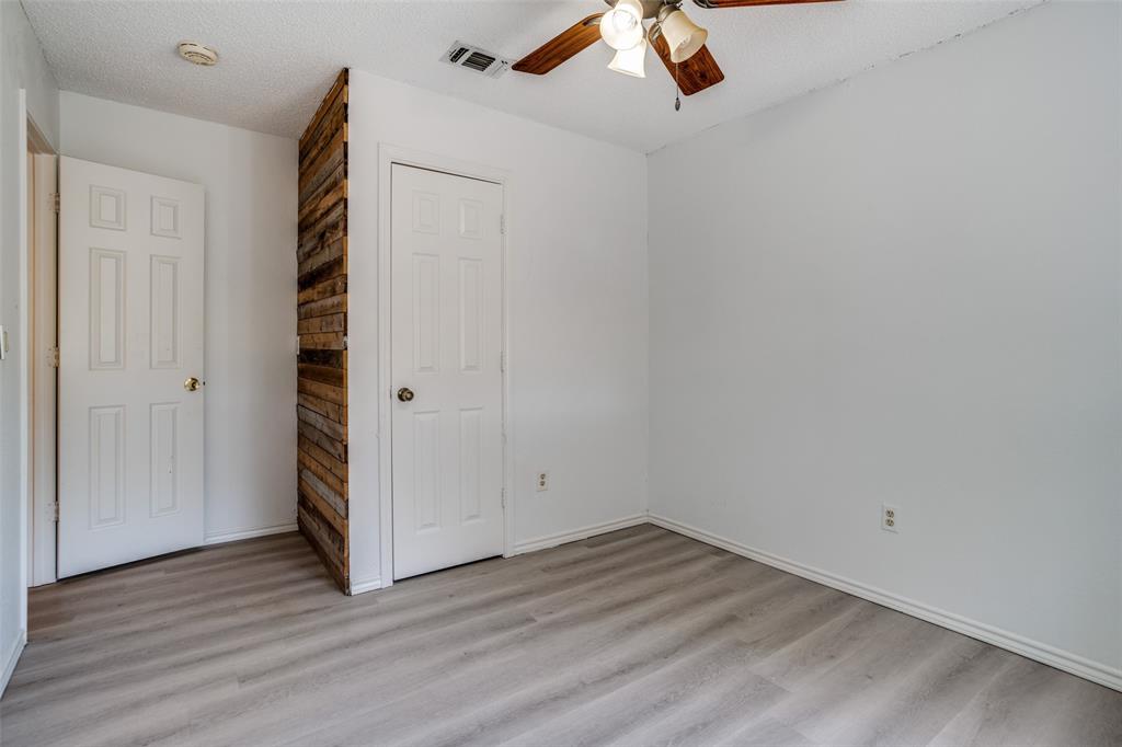 7397 Fm 1377 Blue Ridge, TX 75424 - Photo 19 of 27 an empty room with wooden floor and white walls