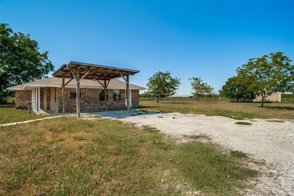 7397 Fm 1377 Blue Ridge, TX 75424 - Photo 24 of 27 a wooden house with swimming pool in front of it