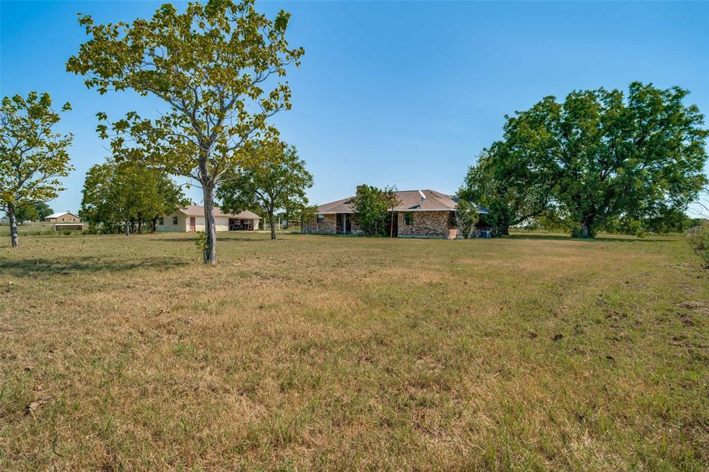 7397 Fm 1377 Blue Ridge, TX 75424 - Photo 25 of 27 a view of a field with trees in the background