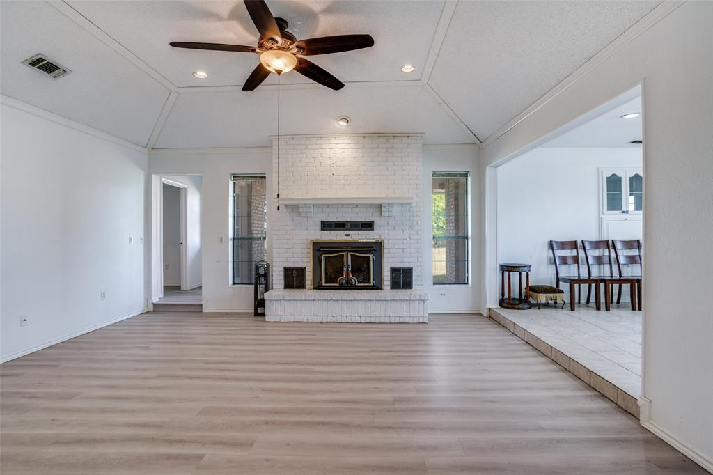 7397 Fm 1377 Blue Ridge, TX 75424 - Photo 7 of 27 an empty room with windows and a fireplace