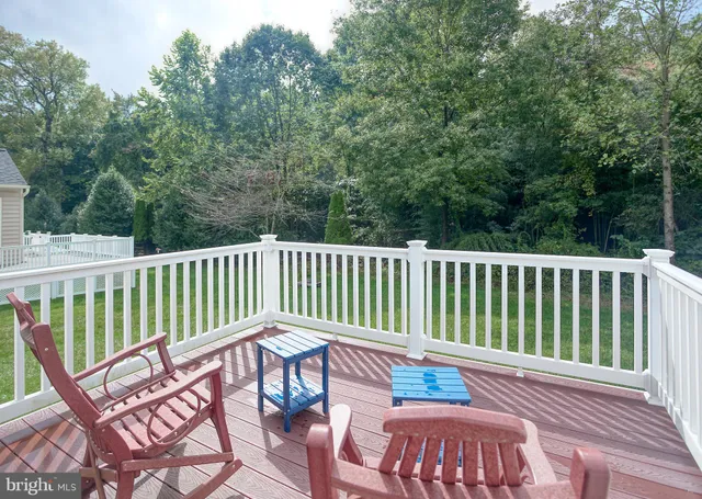 a view of a chair and table on the deck