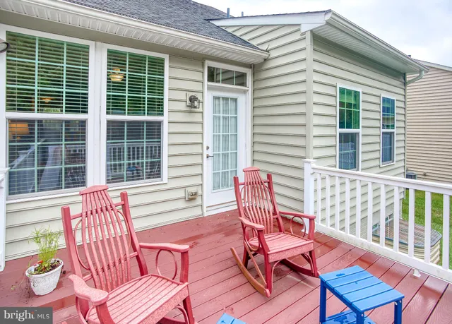 a view of a chair and table in the balcony