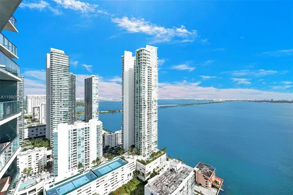 a balcony with furniture and city view