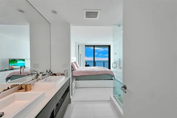 a bedroom with a bed and dresser