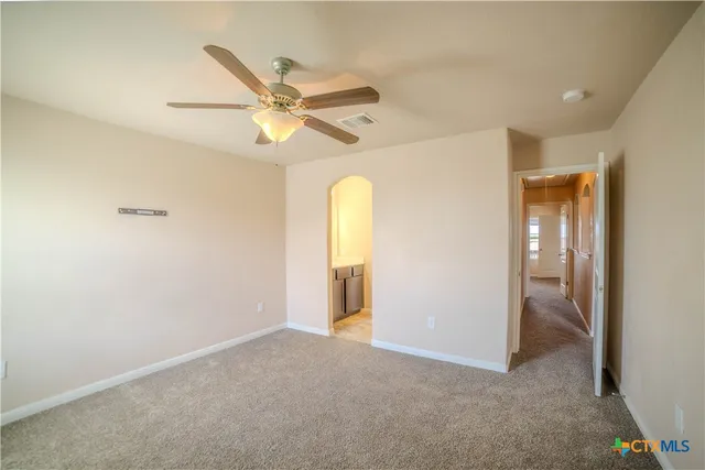 a view of a hallway with a fan