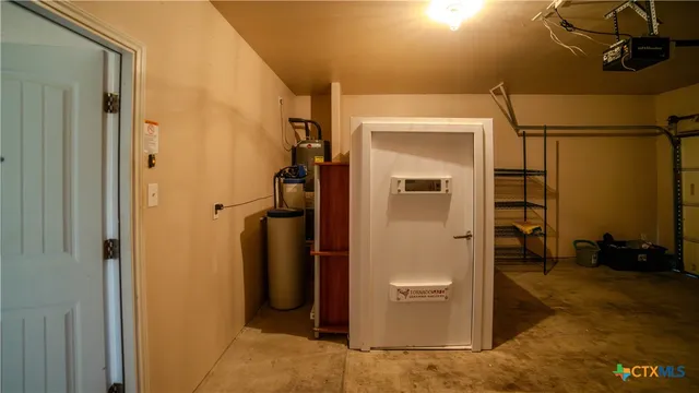 a view of a white house with a yard