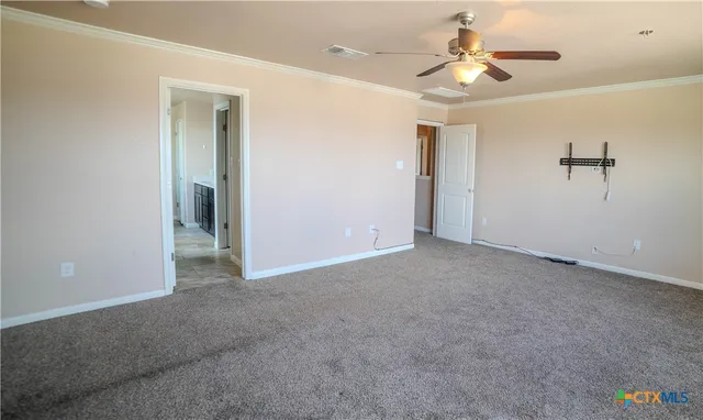 a view of a chandelier fan and closet in a room