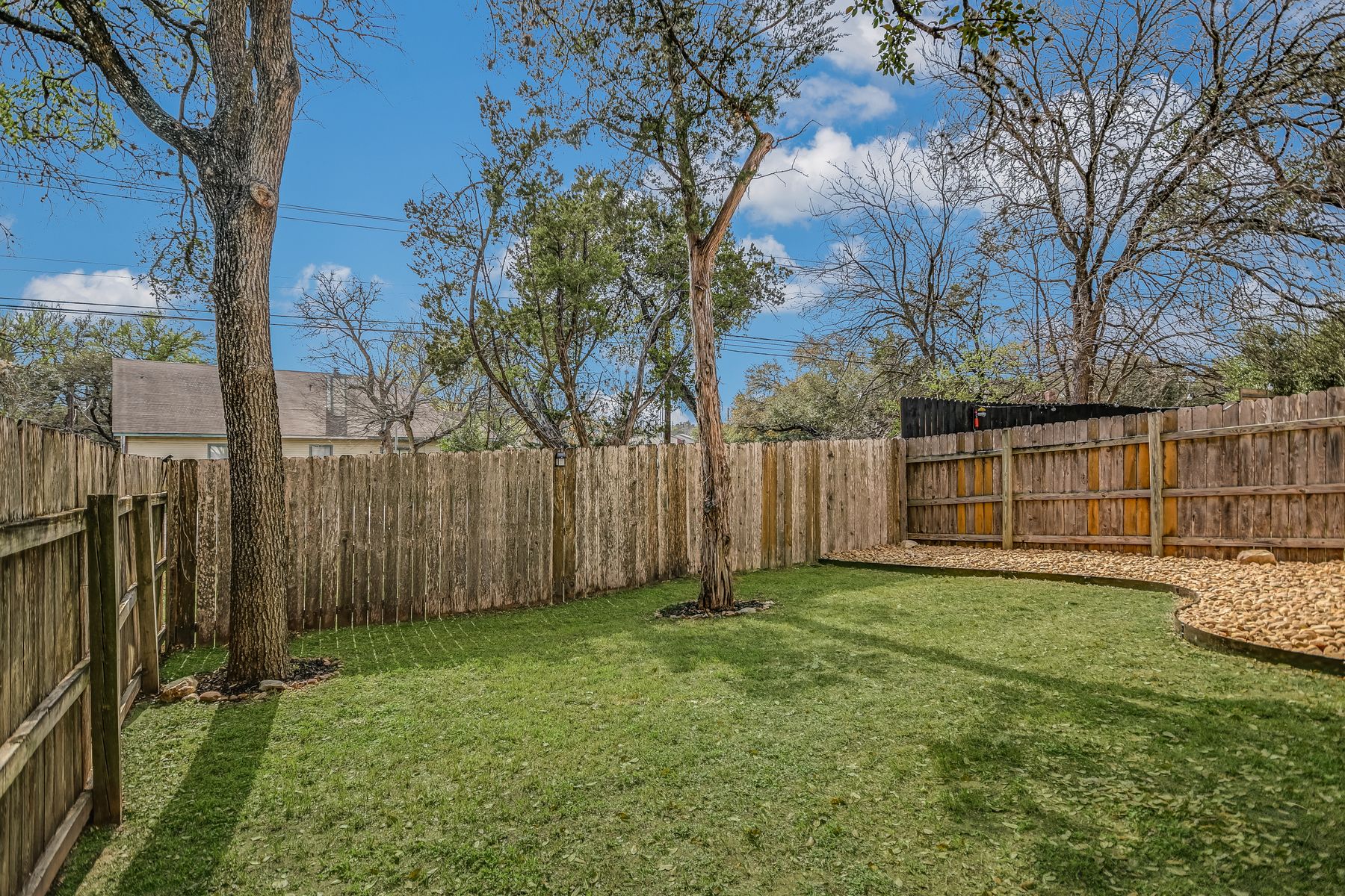 2605 Garrettson Drive, Unit A Austin, TX 78748 - Photo 19 of 21 a view of a yard with wooden fence