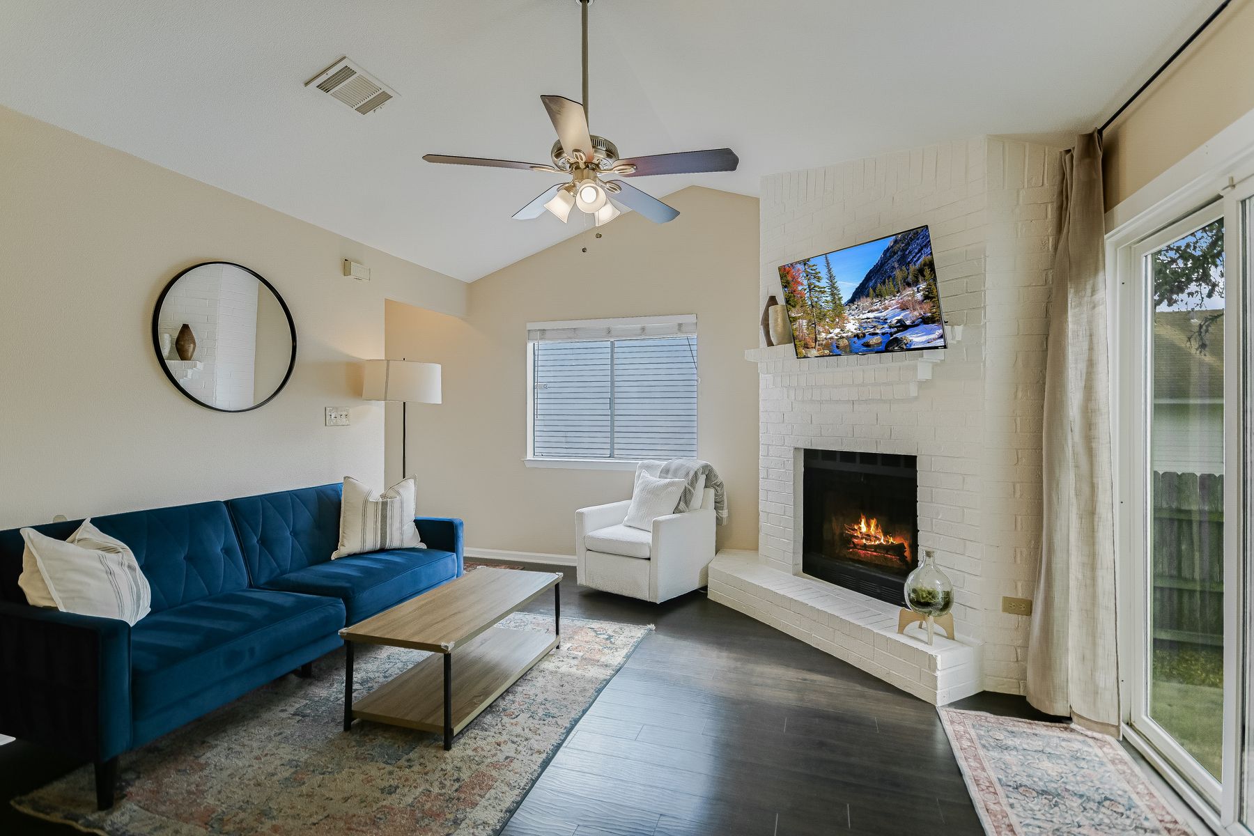 2605 Garrettson Drive, Unit A Austin, TX 78748 - Photo 4 of 21 a living room with furniture a window and a fireplace