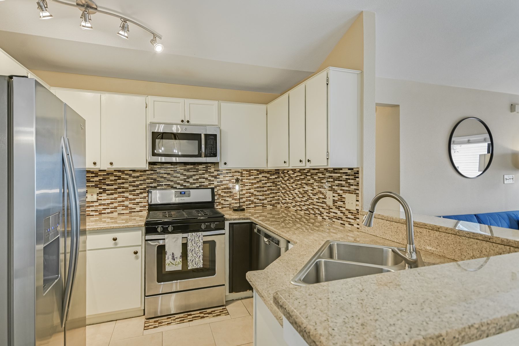 2605 Garrettson Drive, Unit A Austin, TX 78748 - Photo 8 of 21 a kitchen with a sink stove and refrigerator