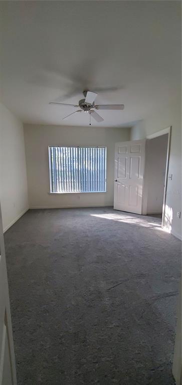 3584 Kings Road, Unit 101 Palm Harbor, FL 34685 - Photo 13 of 17 a view of an empty room with a window
