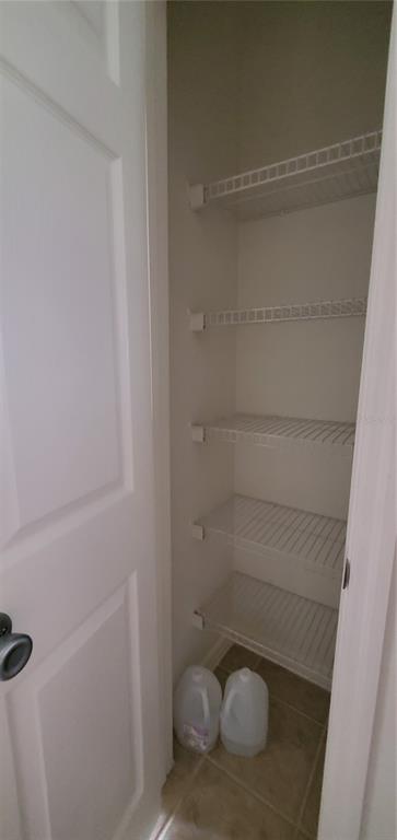 3584 Kings Road, Unit 101 Palm Harbor, FL 34685 - Photo 7 of 17 a bathroom with a glass shower door