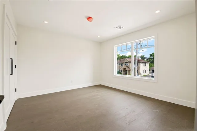 a bathroom with a sink mirror and toilet