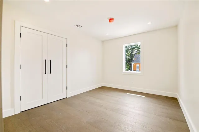 a bathroom with a double vanity sink toilet mirror and bathtub