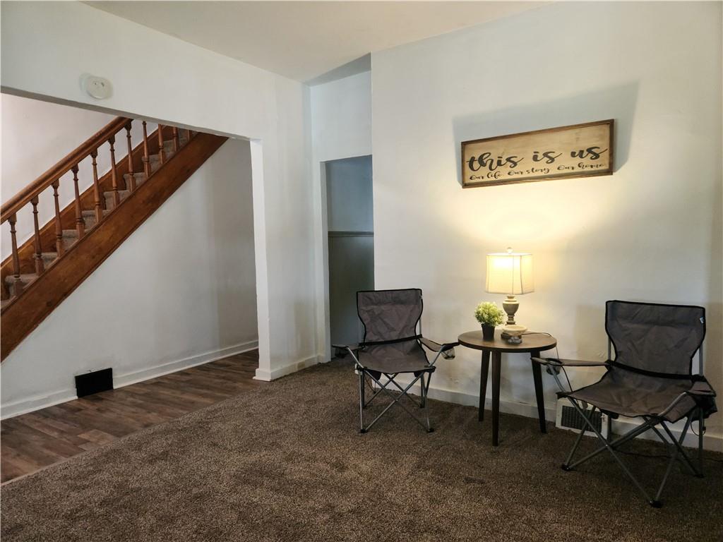 129 Franklin Avenue Vandergrift, PA 15690 - Photo 2 of 8 a view of a livingroom with furniture and a window