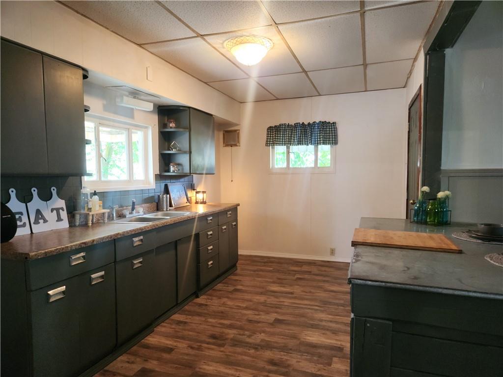 129 Franklin Avenue Vandergrift, PA 15690 - Photo 5 of 8 a kitchen with a sink stove and cabinets