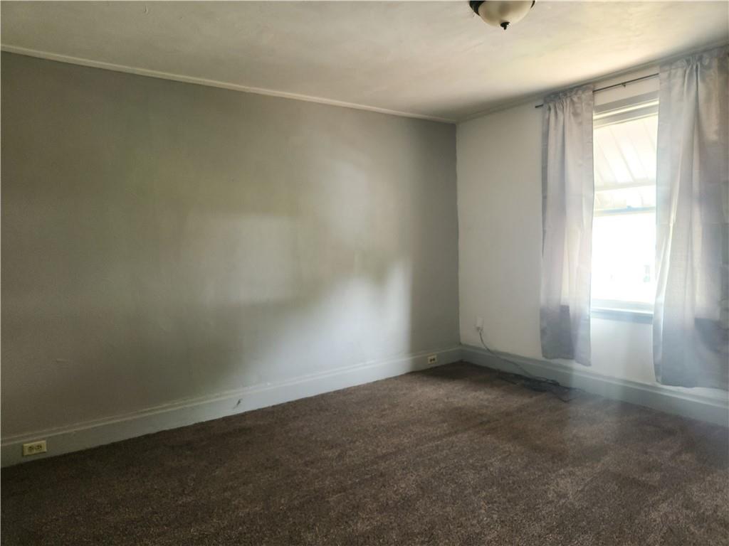 129 Franklin Avenue Vandergrift, PA 15690 - Photo 6 of 8 an empty room with a window