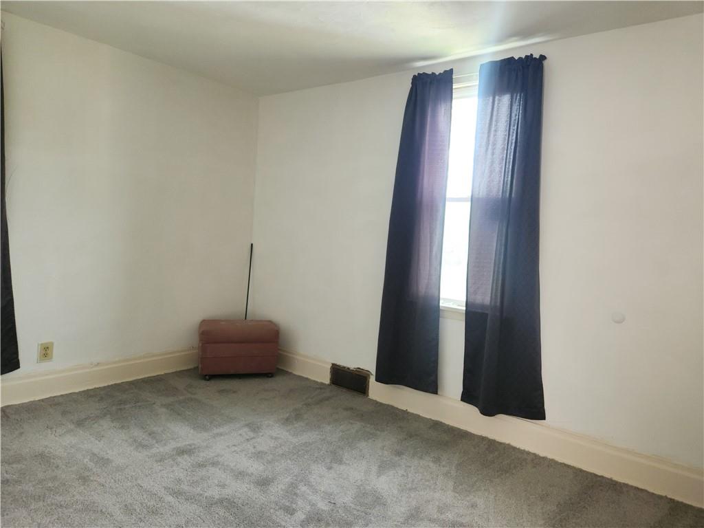 129 Franklin Avenue Vandergrift, PA 15690 - Photo 7 of 8 an empty room with windows