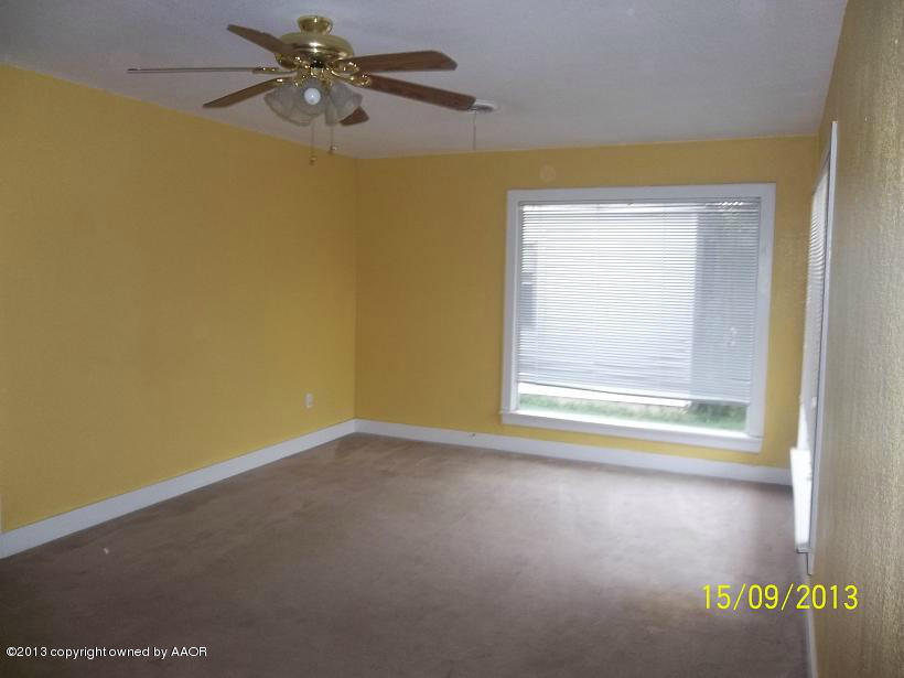 4122 South Harrison Street Amarillo, TX 79110 - Photo 3 of 10 a view of room with window and ceiling fan