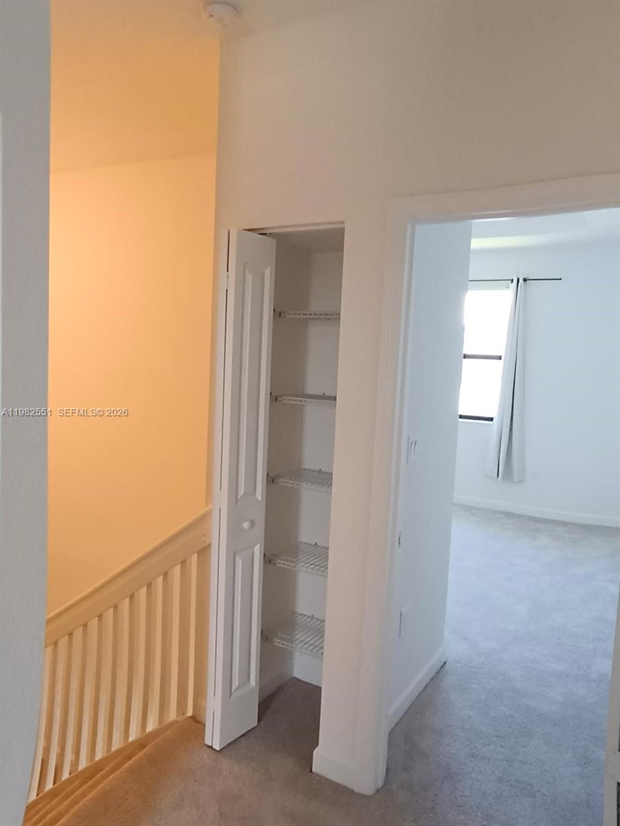 13262 Southwest 285th Street Homestead, FL 33033 - Photo 14 of 16 a view of a hallway and closet