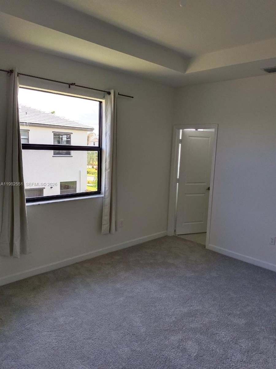 13262 Southwest 285th Street Homestead, FL 33033 - Photo 7 of 16 a view of an empty room with a window