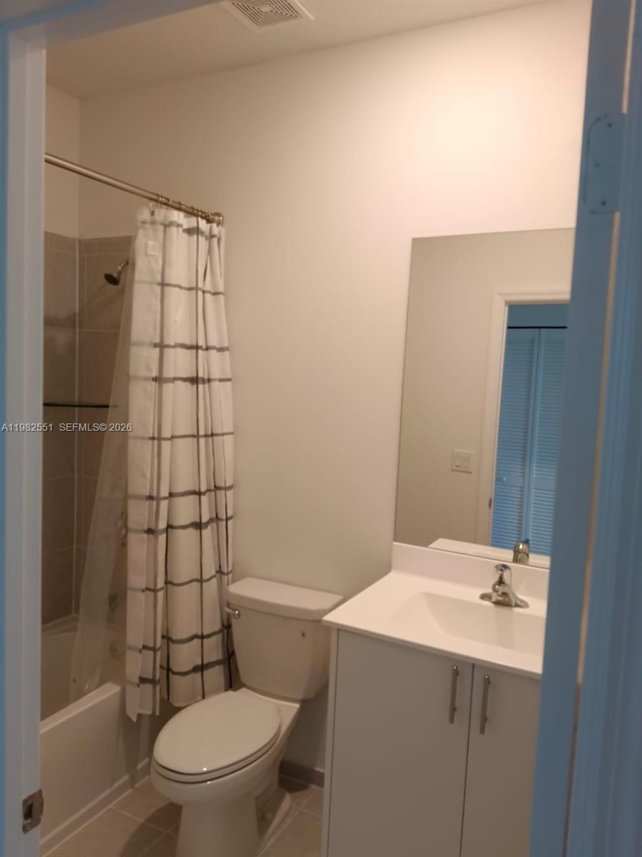 13262 Southwest 285th Street Homestead, FL 33033 - Photo 9 of 16 a bathroom with a toilet a sink and shower