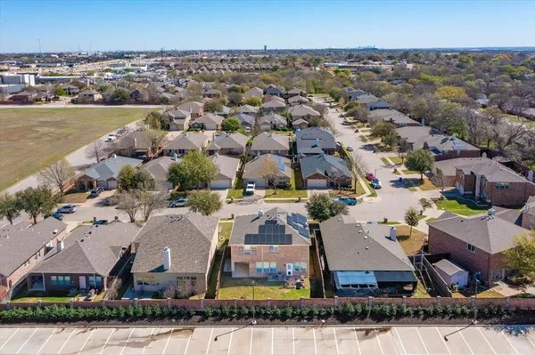 an aerial view of a house with a lake view