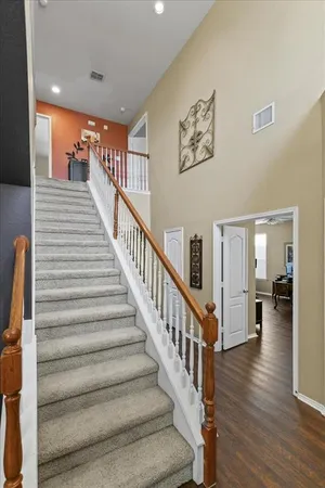 a living room with furniture fireplace and a flat screen tv