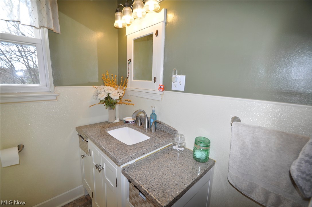 1899 West Pleasant Valley Road Parma, OH 44134 - Photo 31 of 47 Bathroom with vanity and a notable chandelier