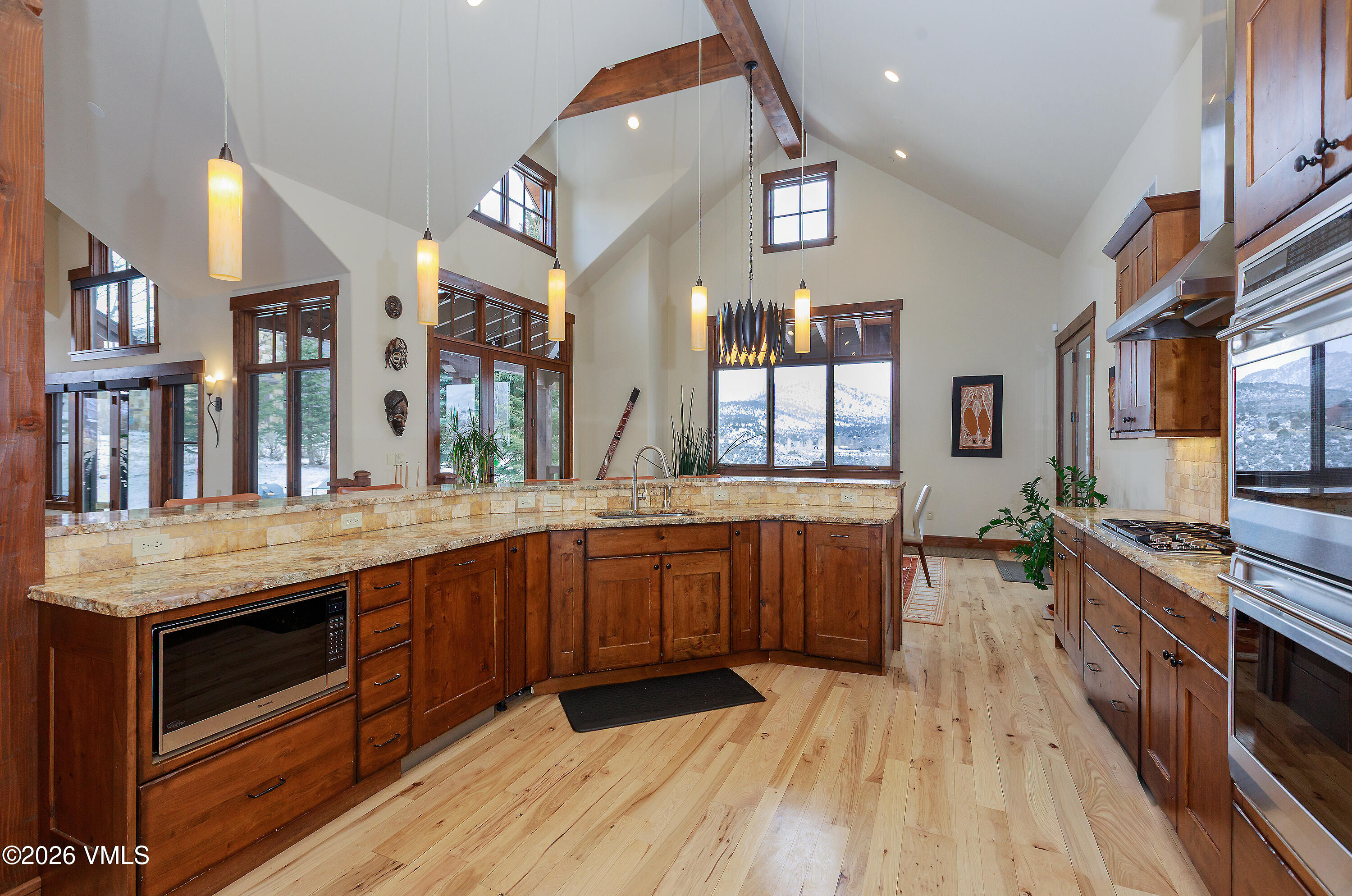 2753 East Haystacker Drive Eagle, CO 81631 - Photo 15 of 41 a large kitchen with stainless steel appliances granite countertop a stove and cabinets