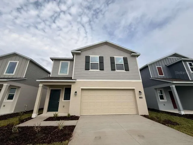 a front view of a house with a garage