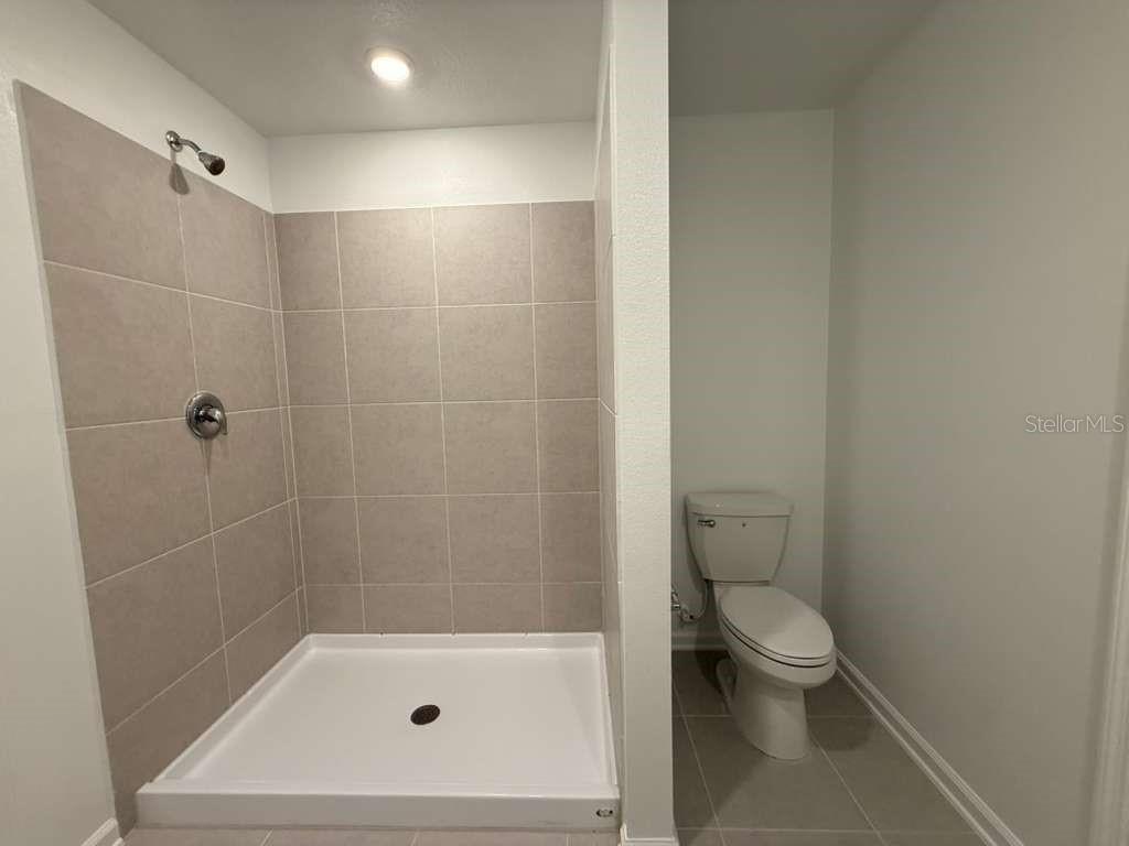 2728 Lookout Rdg Road Haines City, FL 33844 - Photo 14 of 21 a bathroom with a shower a toilet and a sink