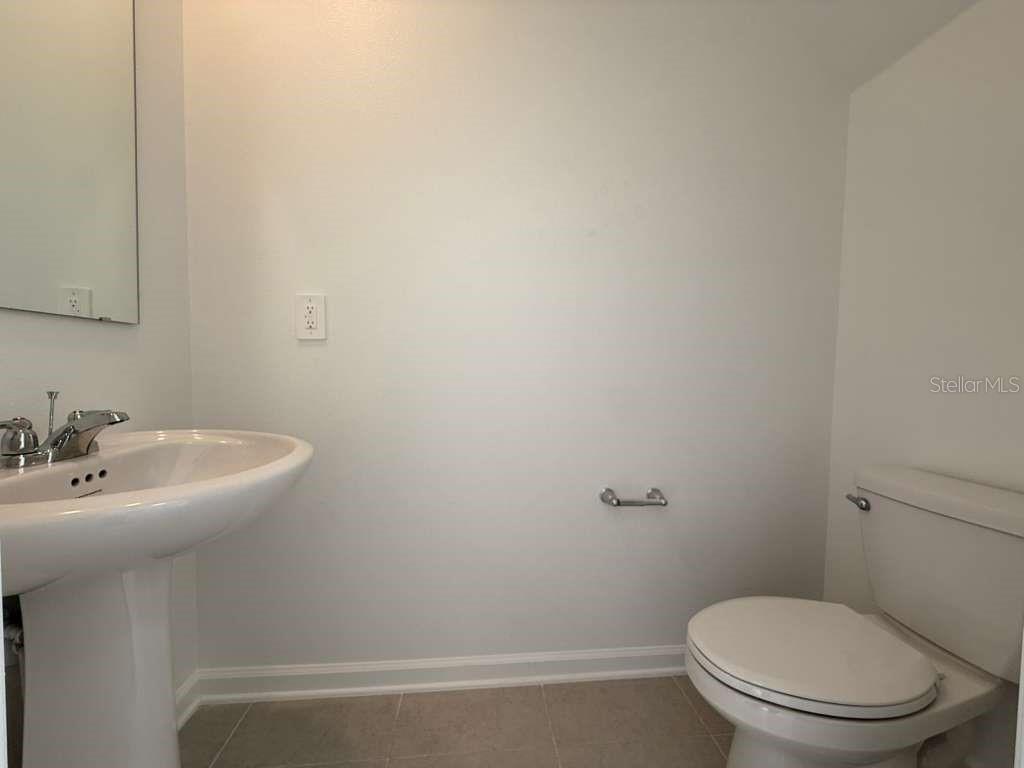 2728 Lookout Rdg Road Haines City, FL 33844 - Photo 5 of 21 a bathroom with a sink and a toilet