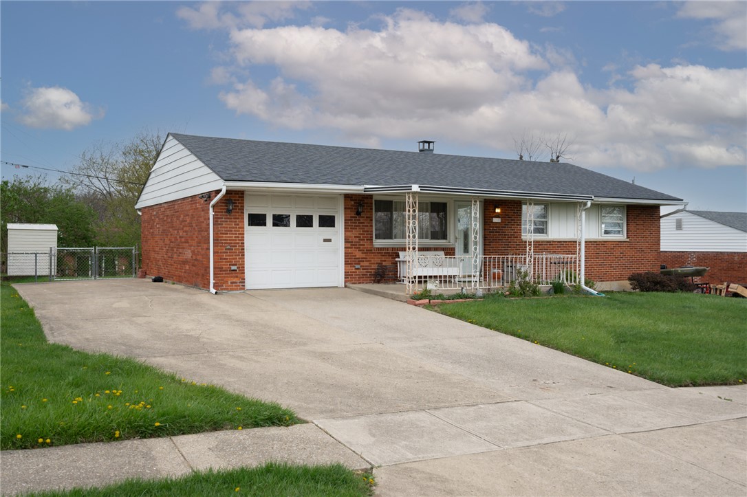 795 Spring Garden Place Dayton, OH 45431 - Photo 1 of 34 This charming residence features a brick exterior and a spacious driveway leading to an attached garage.
