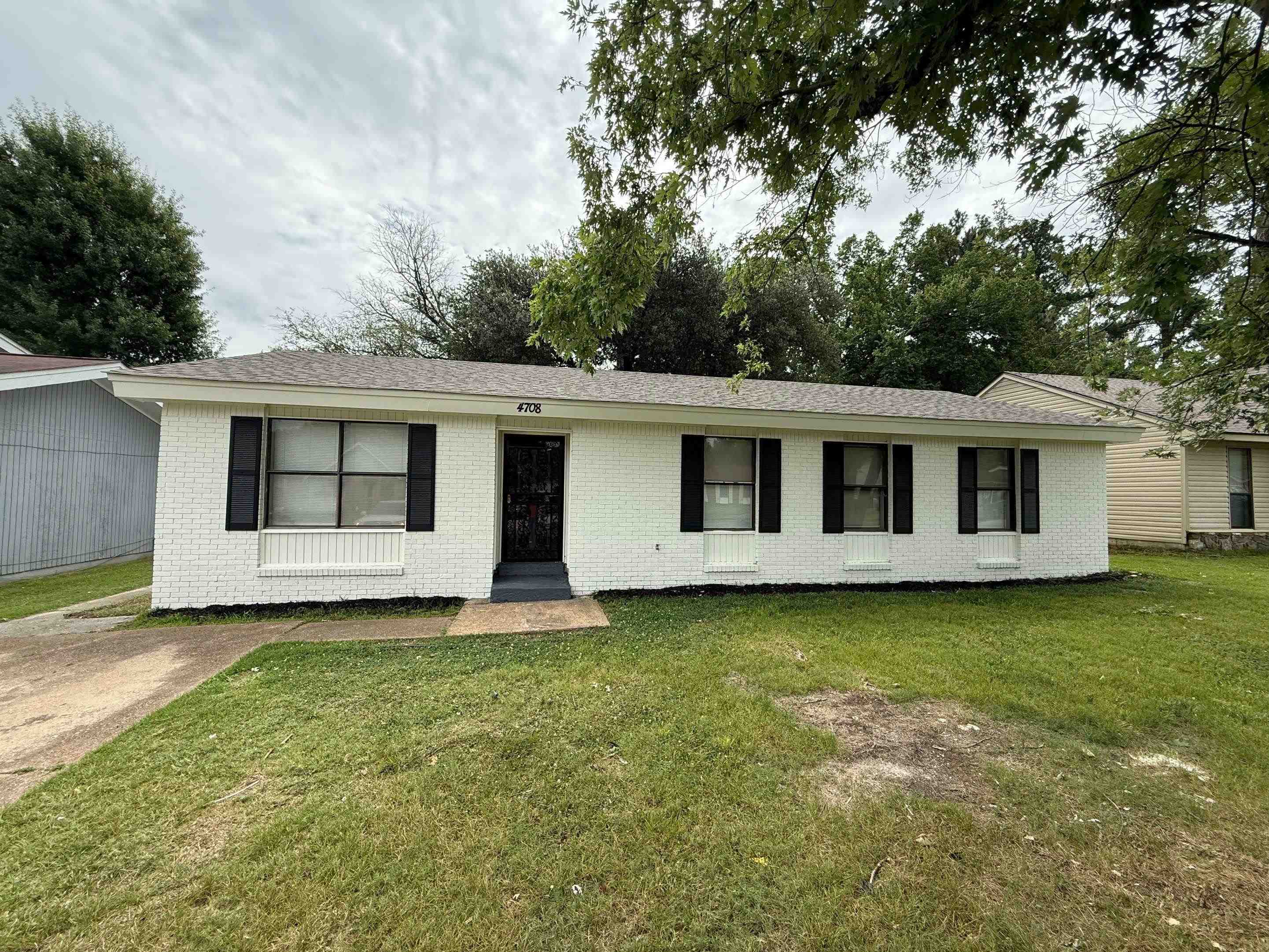 4708 Laughlin Road Memphis, TN 38118 - Photo 1 of 12 Single story home with a front lawn and brick siding
