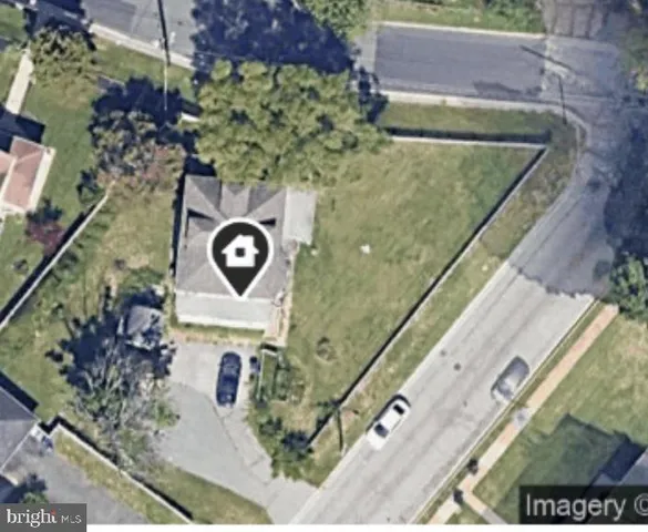 a aerial view of a house with a yard